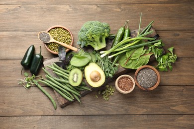 Photo of Superfood. Different healthy products on wooden table, flat lay