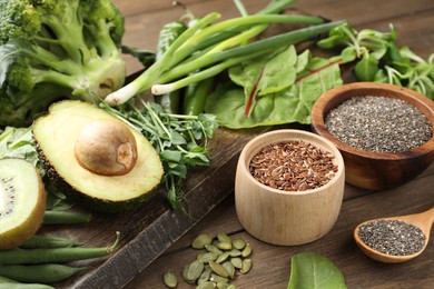 Photo of Superfood. Different healthy products on wooden table, closeup