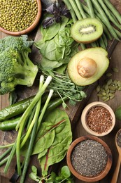 Photo of Superfood. Different healthy products on wooden table, flat lay