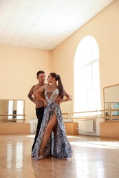 Photo of Couple of professional dancers training in studio