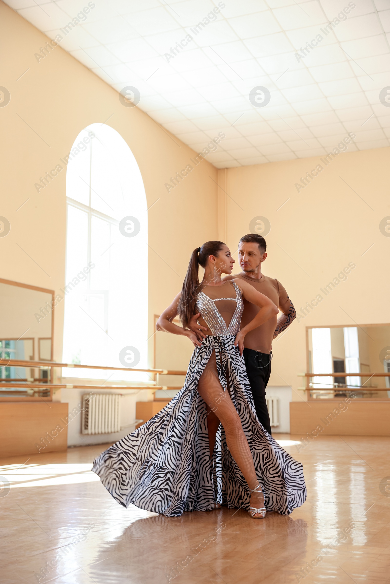 Couple of professional dancers training in studio Photo of Couple of professional dancers training in studio
