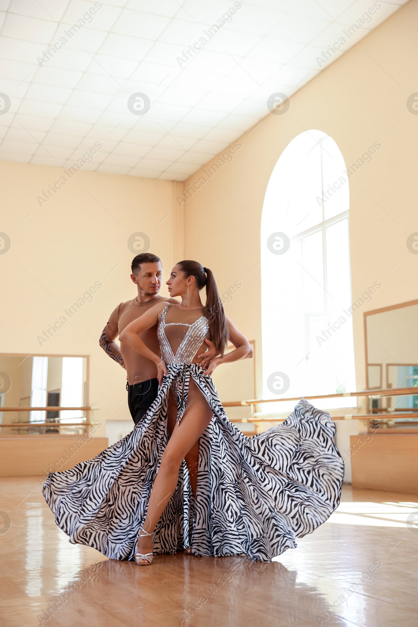 Couple of professional dancers training in studio Photo of Couple of professional dancers training in studio