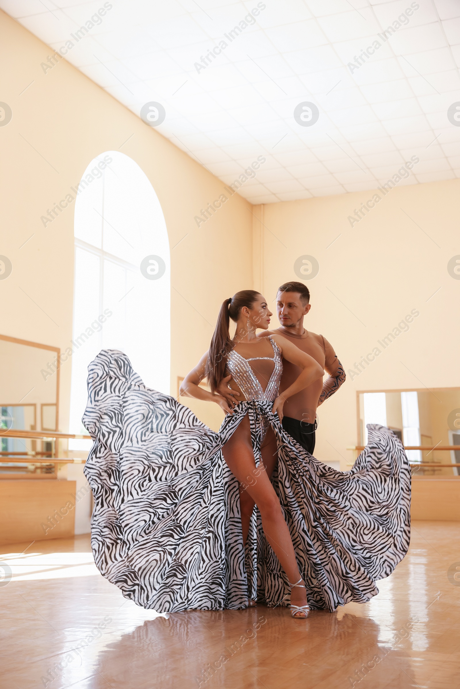 Couple of professional dancers training in studio Photo of Couple of professional dancers training in studio