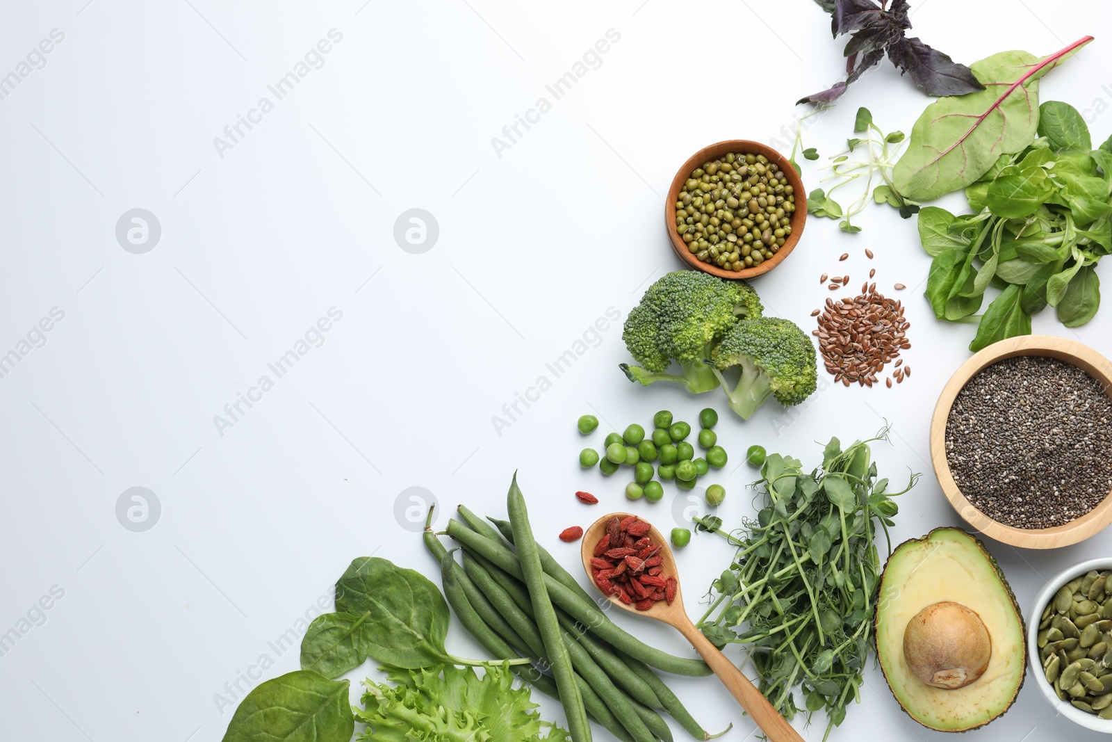 Superfood. Different healthy products on white background, flat lay. Space for text Photo of Superfood. Different healthy products on white background, flat lay. Space for text