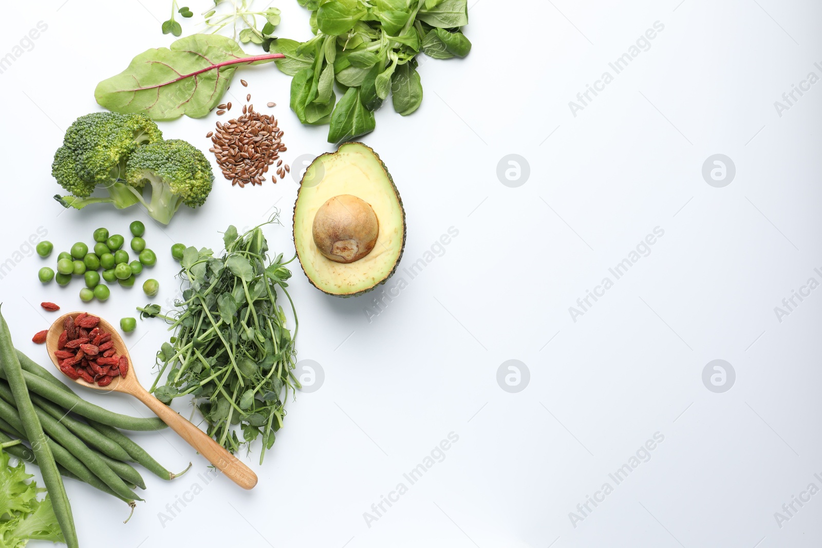 Superfood. Different healthy products on white background, flat lay. Space for text Photo of Superfood. Different healthy products on white background, flat lay. Space for text