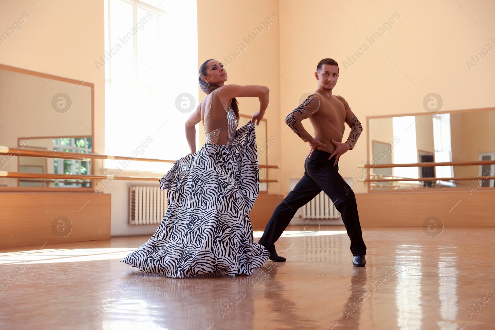 Couple of professional dancers training in studio Photo of Couple of professional dancers training in studio