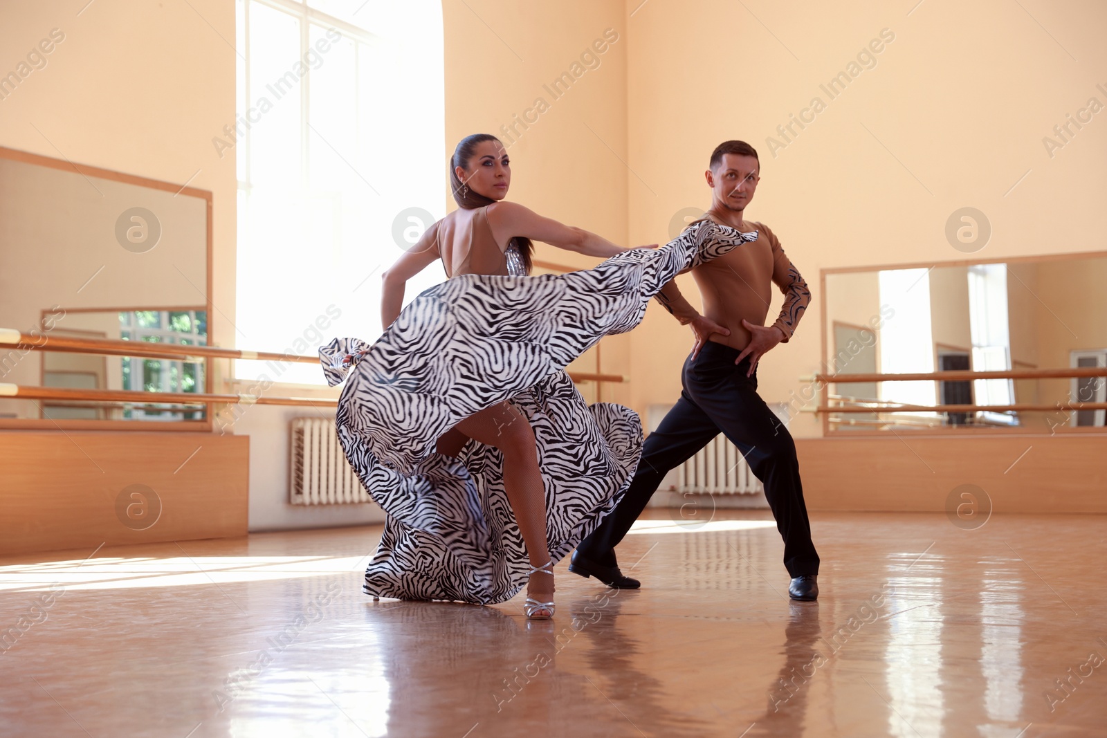 Couple of professional dancers training in studio Photo of Couple of professional dancers training in studio