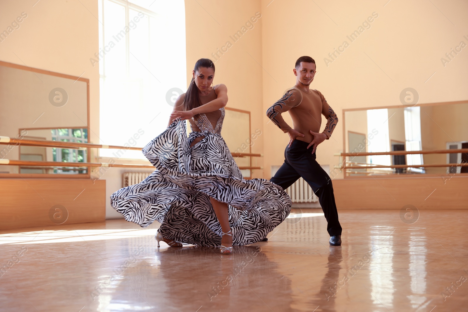 Couple of professional dancers training in studio Photo of Couple of professional dancers training in studio