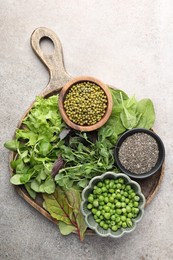 Photo of Superfood. Different healthy products on light grey table, top view