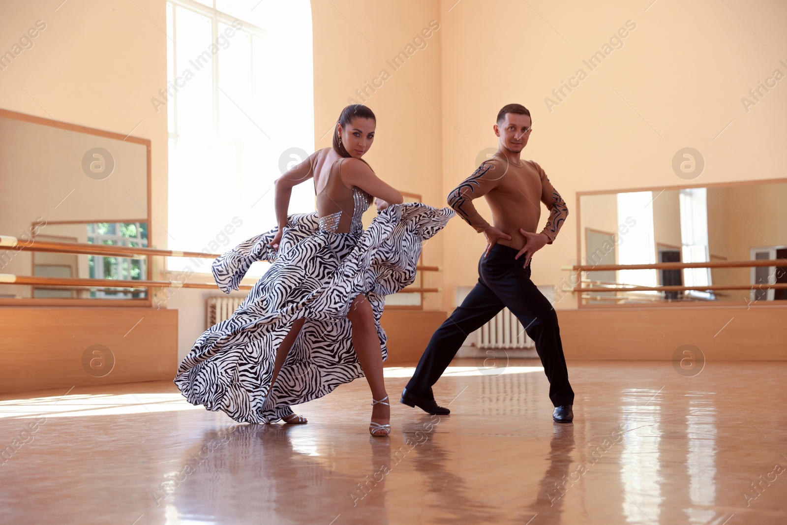 Couple of professional dancers training in studio Photo of Couple of professional dancers training in studio