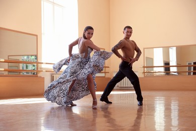 Photo of Couple of professional dancers training in studio