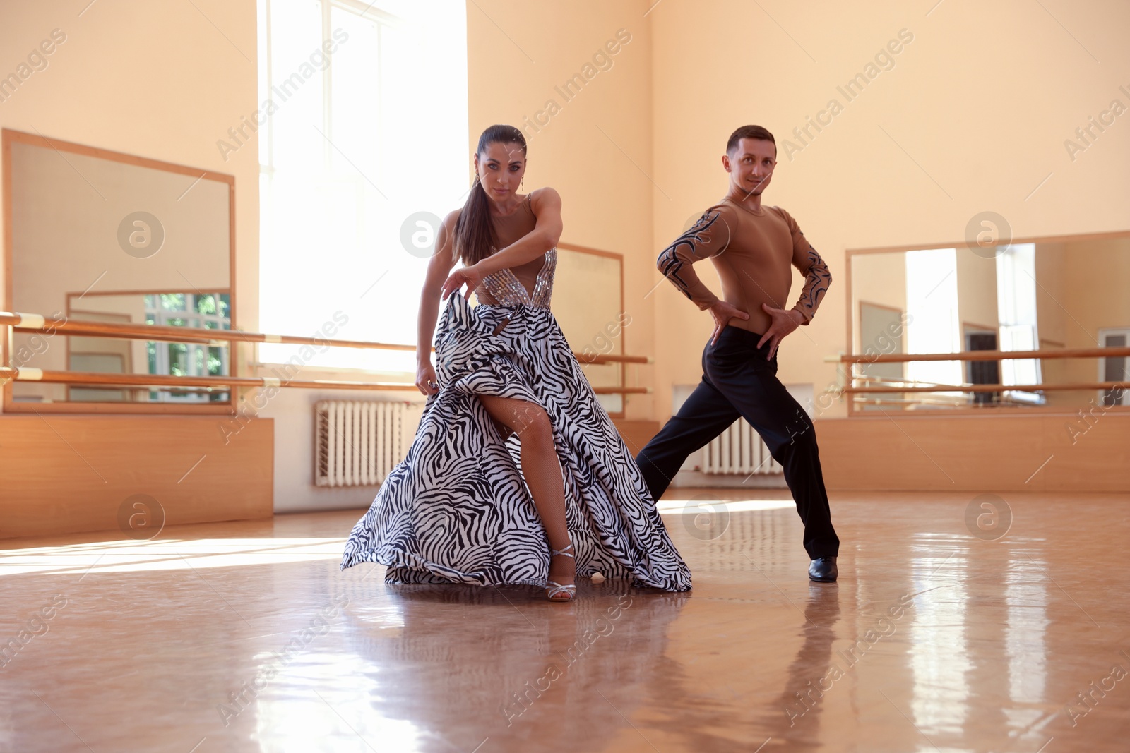 Couple of professional dancers training in studio Photo of Couple of professional dancers training in studio