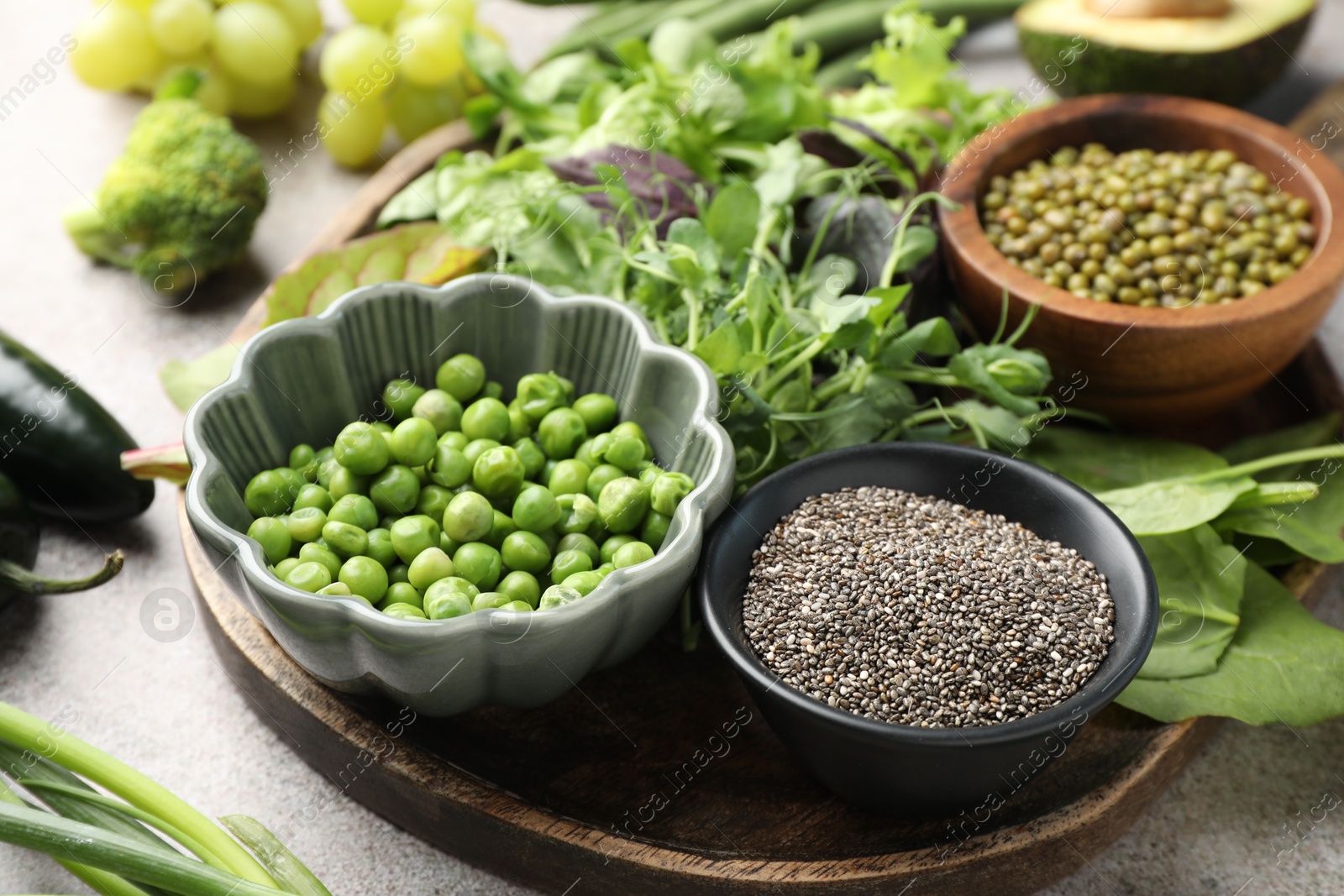 Superfood. Different healthy products on light grey table, closeup Photo of Superfood. Different healthy products on light grey table, closeup