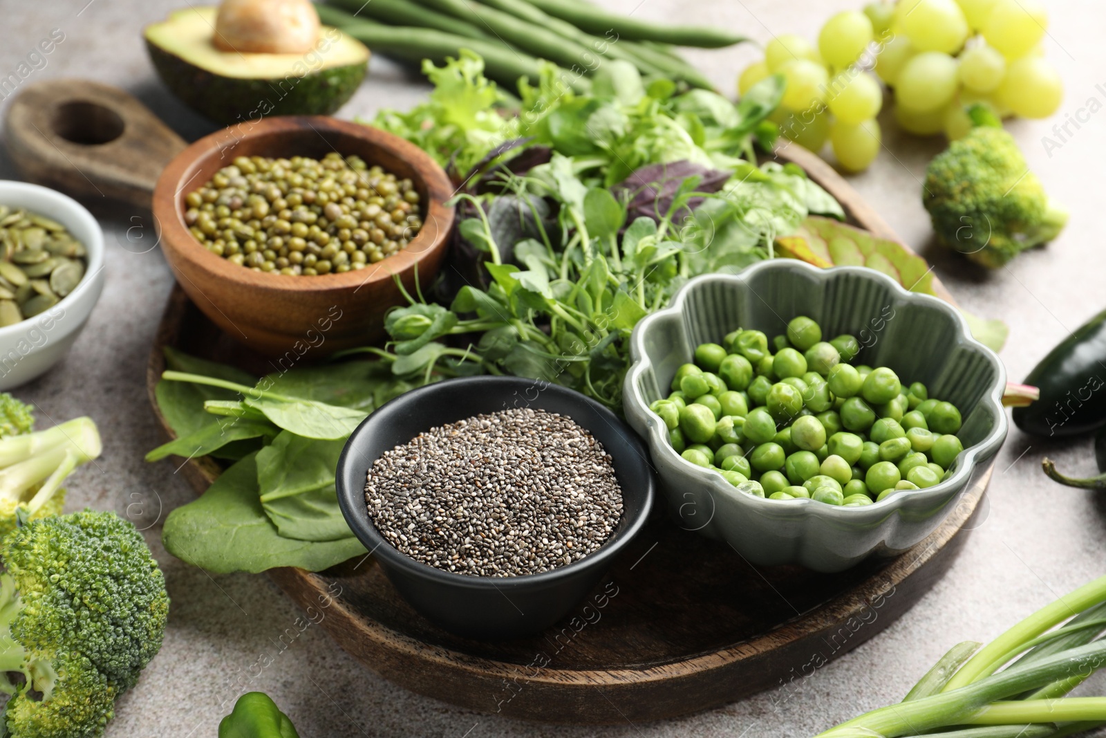 Photo of Superfood. Different healthy products on light grey table, closeup