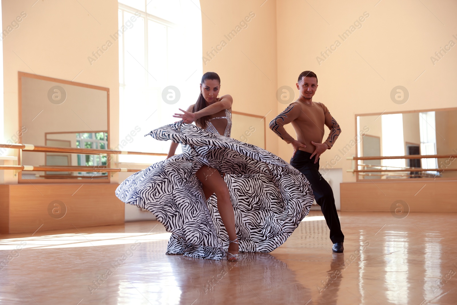 Couple of professional dancers training in studio Photo of Couple of professional dancers training in studio