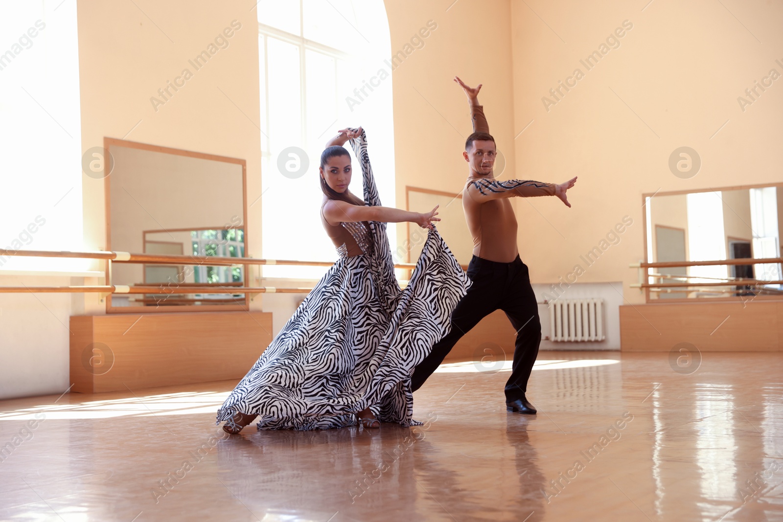 Couple of professional dancers training in studio Photo of Couple of professional dancers training in studio