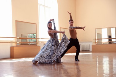 Photo of Couple of professional dancers training in studio