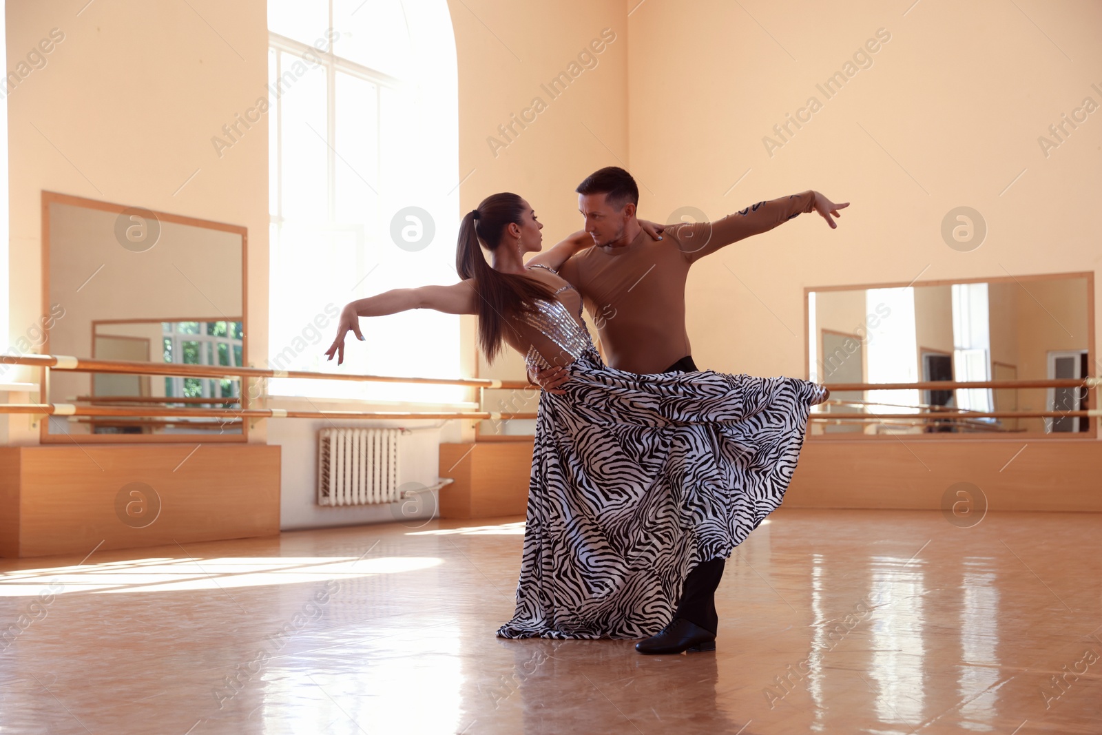 Couple of professional dancers training in studio Photo of Couple of professional dancers training in studio