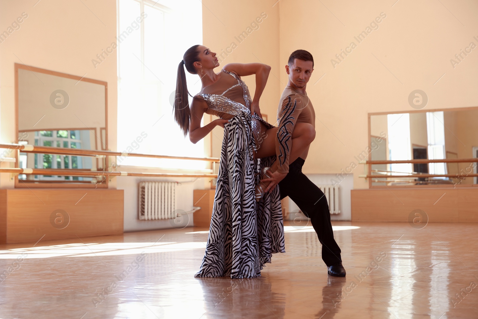 Couple of professional dancers training in studio Photo of Couple of professional dancers training in studio