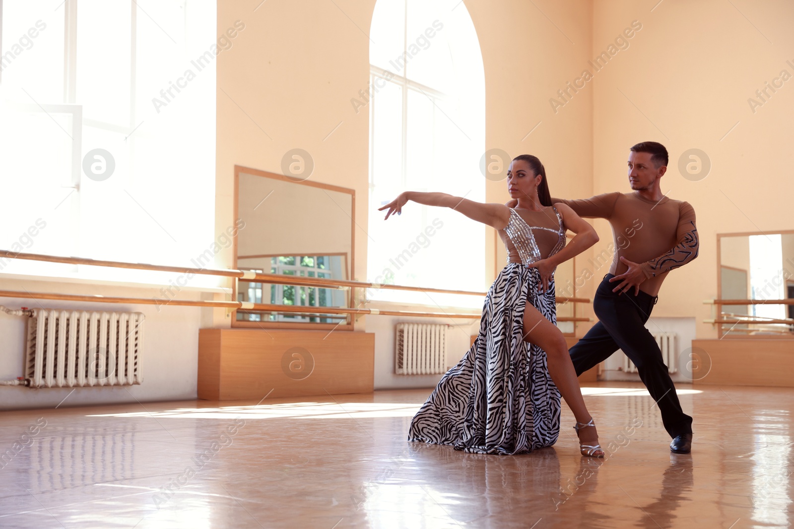 Couple of professional dancers training in studio Photo of Couple of professional dancers training in studio