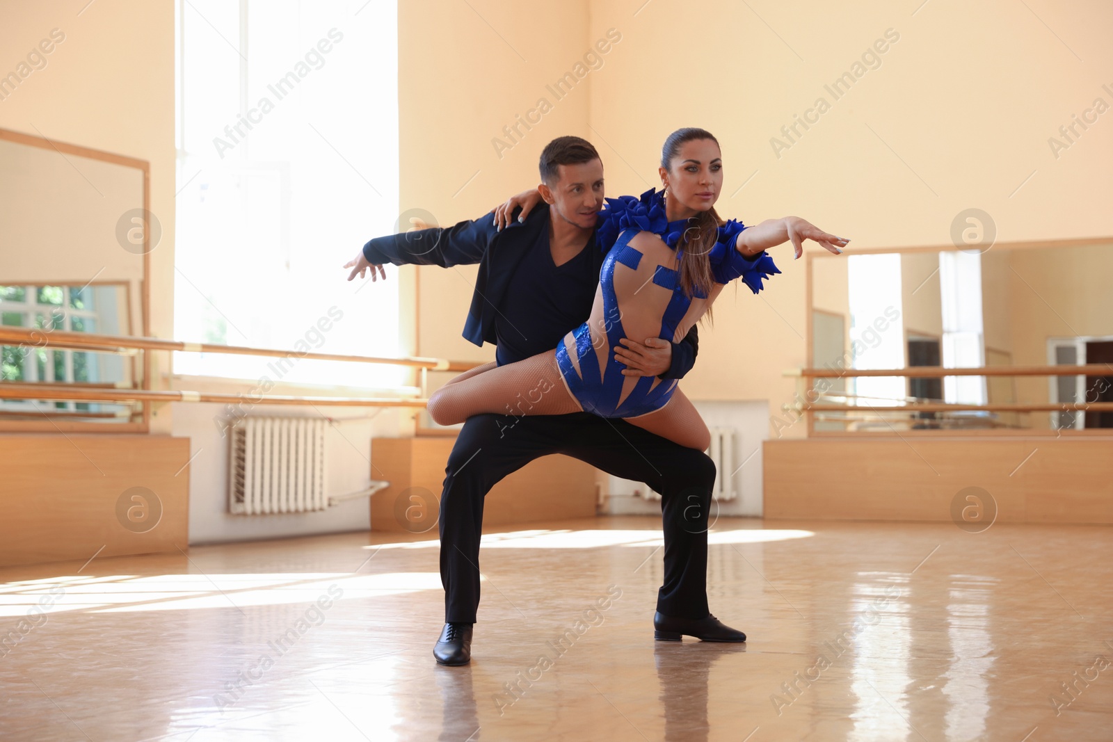Couple of professional dancers training in studio Photo of Couple of professional dancers training in studio