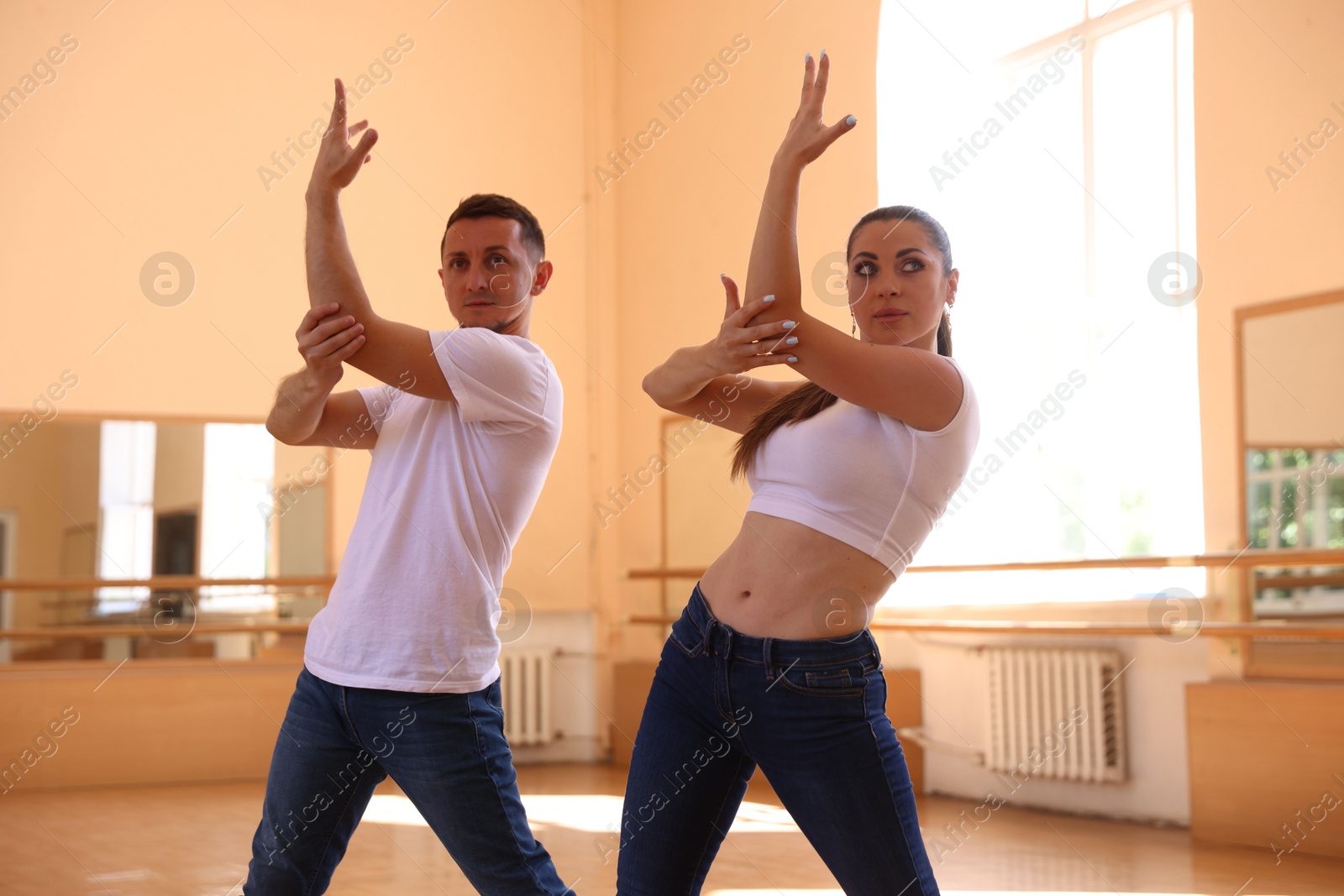 Couple of professional dancers training in studio Photo of Couple of professional dancers training in studio