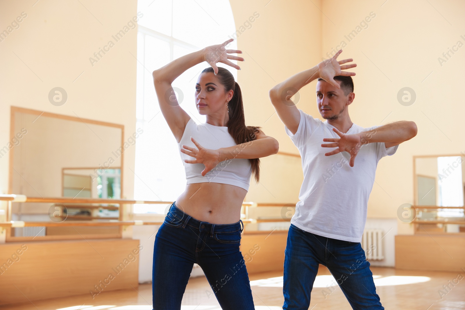 Couple of professional dancers training in studio Photo of Couple of professional dancers training in studio