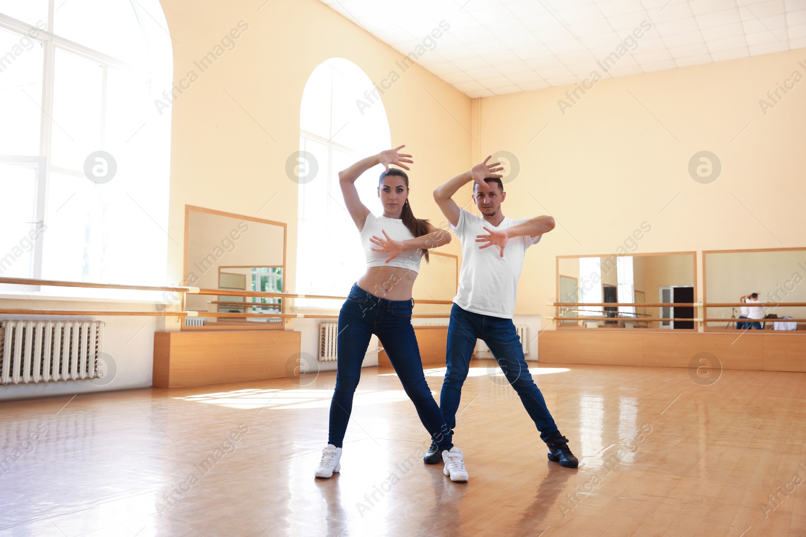 Couple of professional dancers training in studio Photo of Couple of professional dancers training in studio
