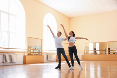 Photo of Couple of professional dancers training in studio