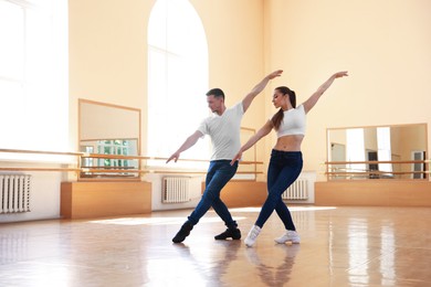 Photo of Couple of professional dancers training in studio