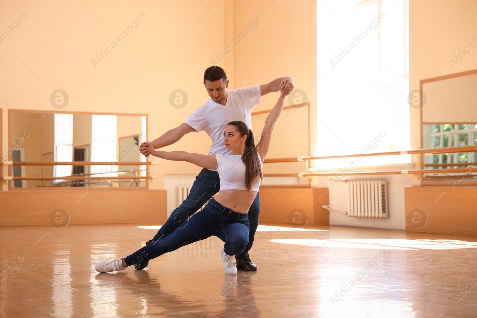 Couple of professional dancers training in studio Photo of Couple of professional dancers training in studio