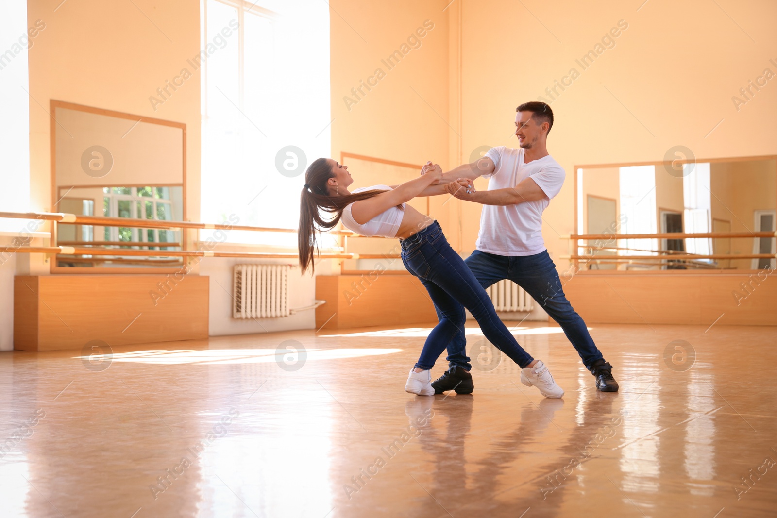 Couple of professional dancers training in studio Photo of Couple of professional dancers training in studio