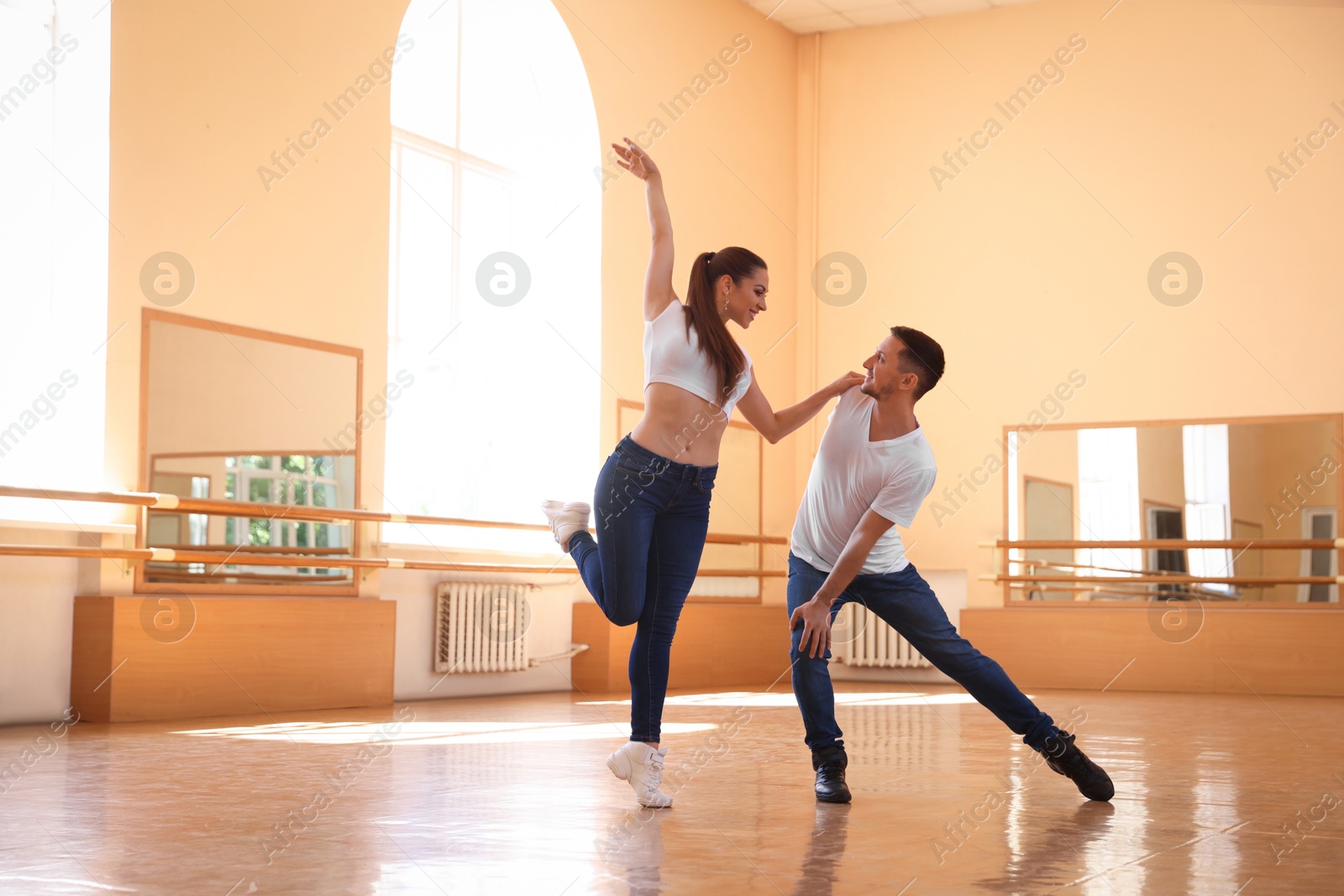 Couple of professional dancers training in studio Photo of Couple of professional dancers training in studio