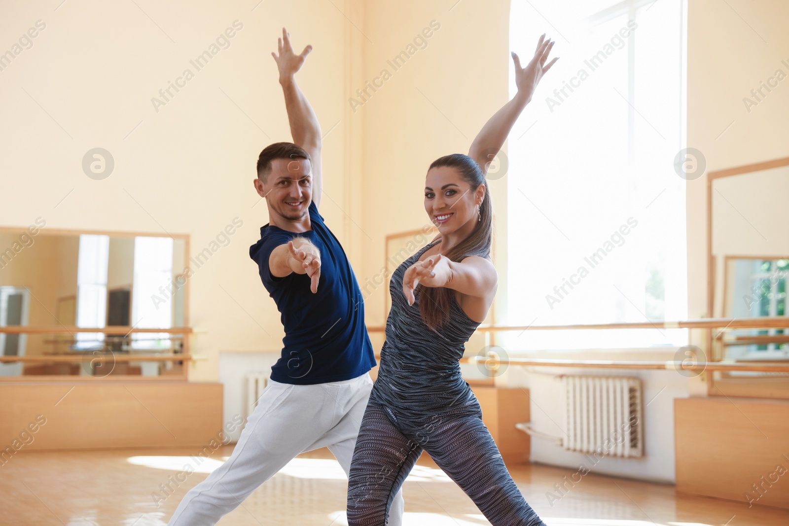 Couple of professional dancers training in studio Photo of Couple of professional dancers training in studio