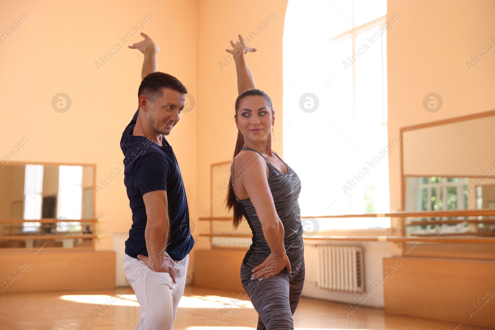 Couple of professional dancers training in studio Photo of Couple of professional dancers training in studio
