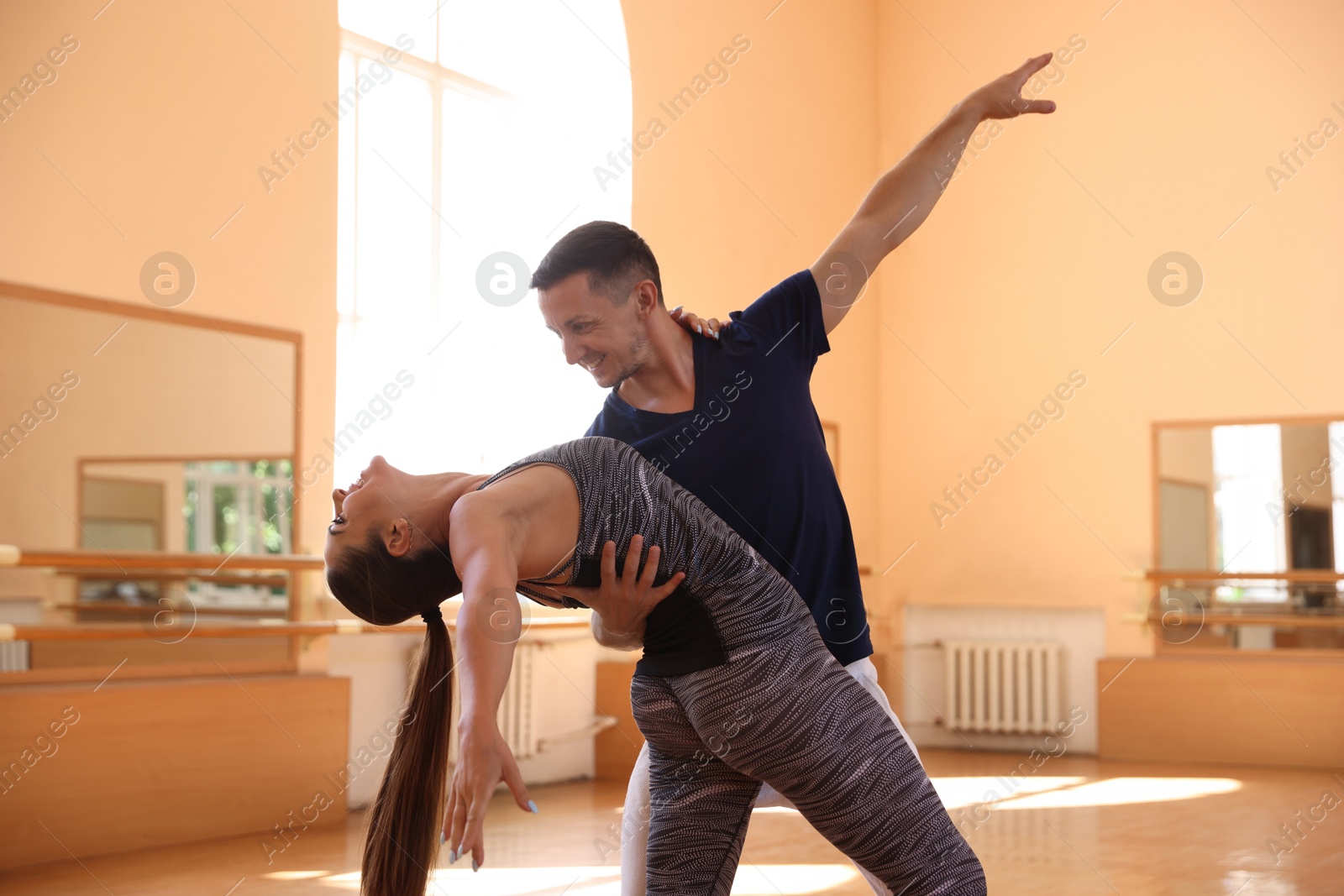 Couple of professional dancers training in studio Photo of Couple of professional dancers training in studio