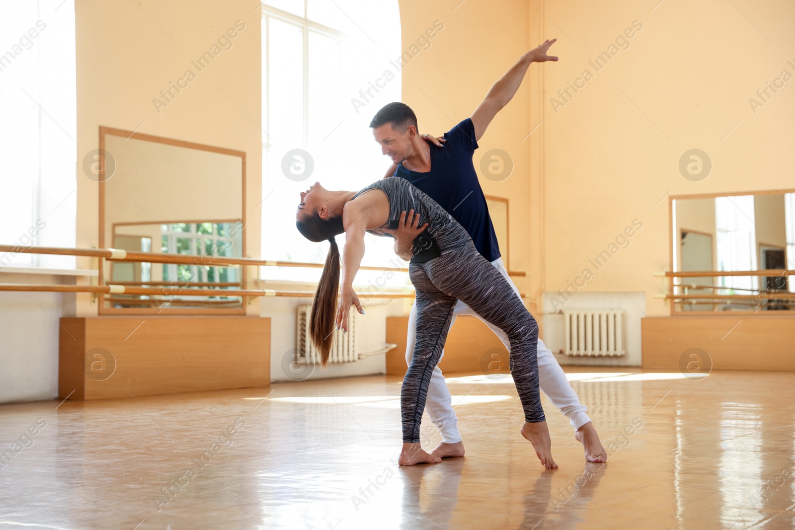 Couple of professional dancers training in studio Photo of Couple of professional dancers training in studio