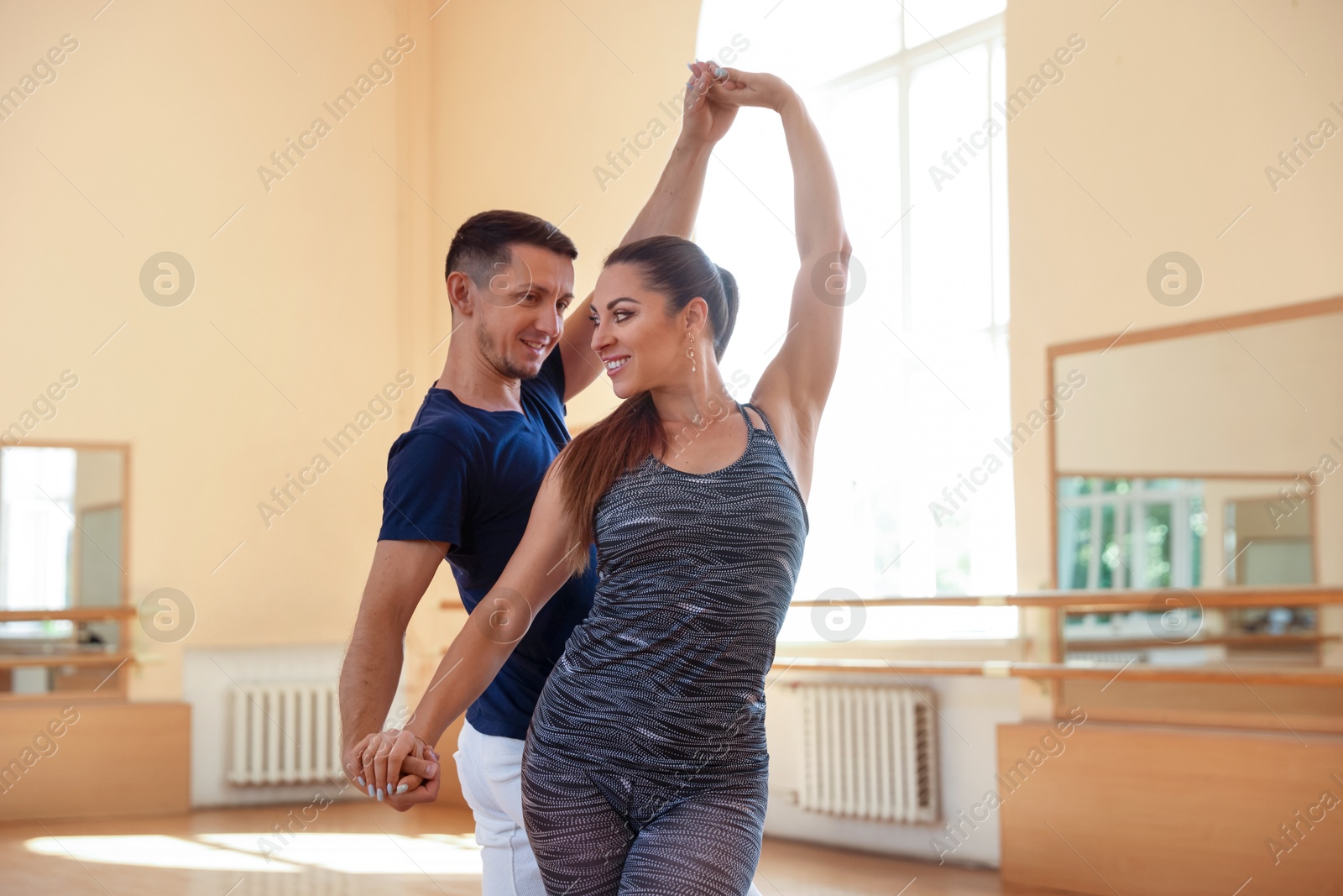 Couple of professional dancers training in studio Photo of Couple of professional dancers training in studio