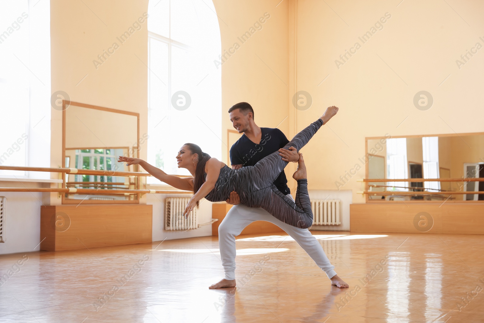 Couple of professional dancers training in studio Photo of Couple of professional dancers training in studio