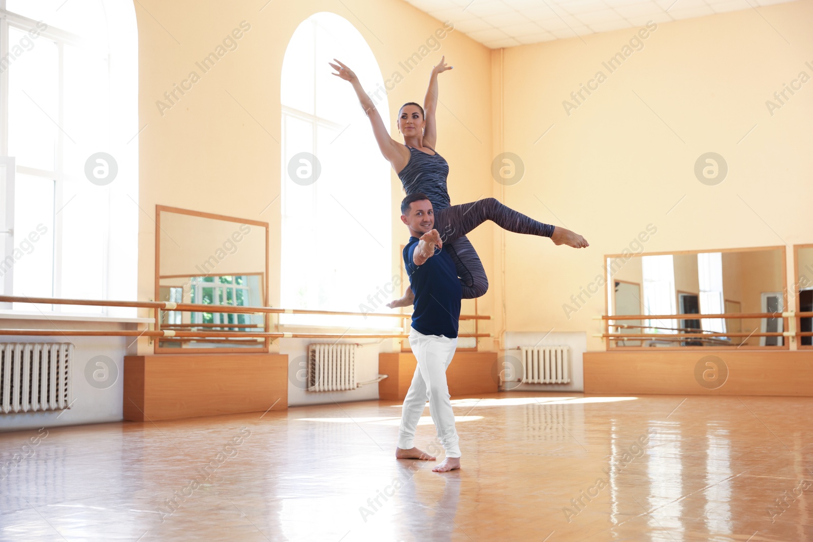 Couple of professional dancers training in studio Photo of Couple of professional dancers training in studio