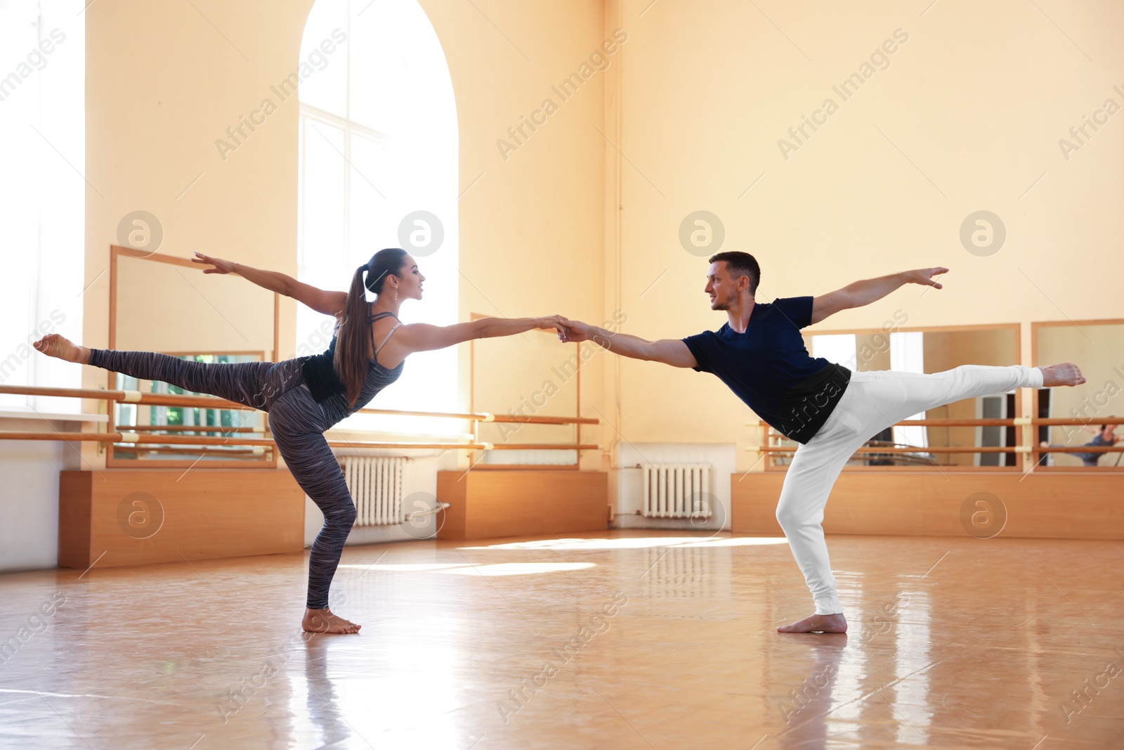 Couple of professional dancers training in studio Photo of Couple of professional dancers training in studio