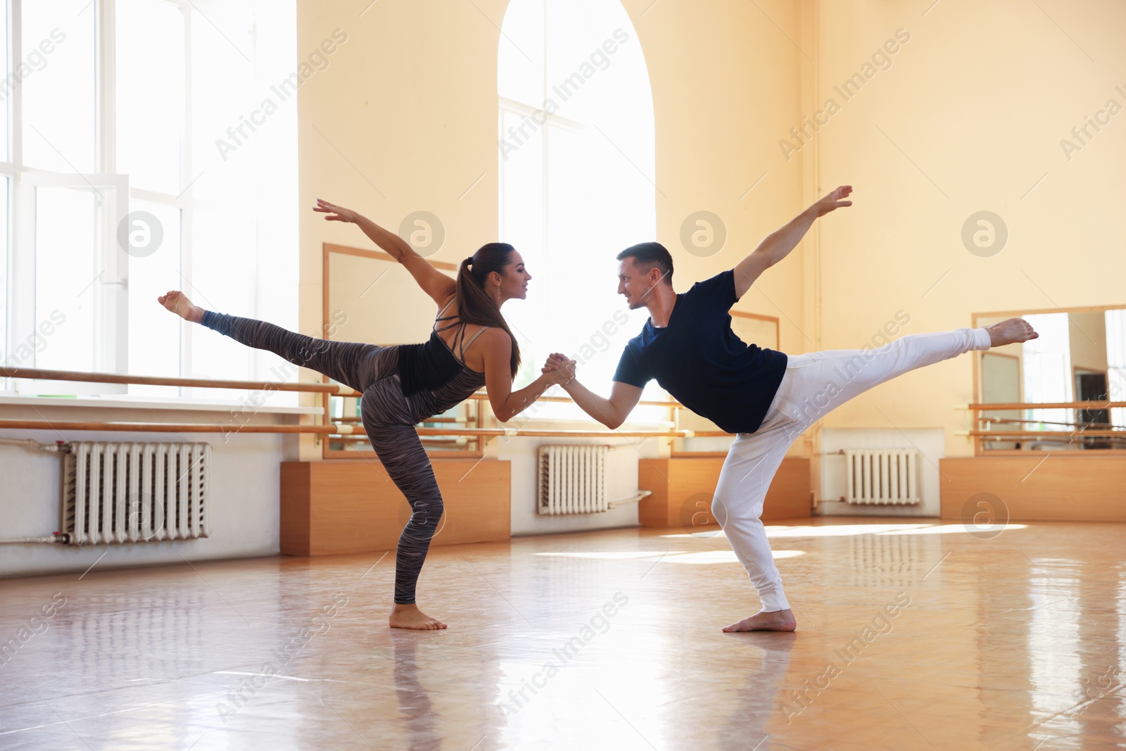 Couple of professional dancers training in studio Photo of Couple of professional dancers training in studio