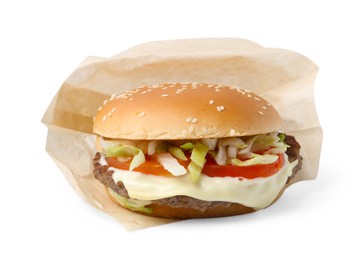 Photo of One delicious burger with cheese, tomato, lettuce and patty in takeaway package isolated on white. Tasty fast food
