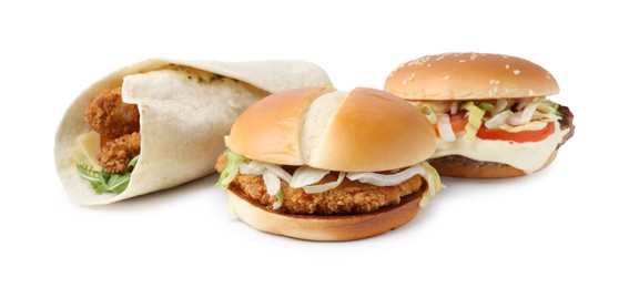 Photo of Delicious burgers and wrap isolated on white. Tasty fast food