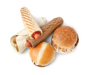 Photo of Delicious burgers, hot dogs and wrap isolated on white, top view. Tasty fast food