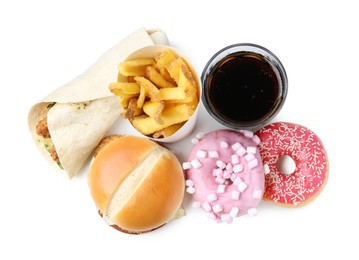 Photo of Different delicious fast food and cola isolated on white, top view