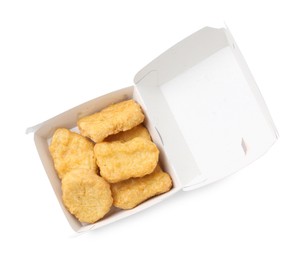 Photo of Delicious nuggets in takeaway package isolated on white, top view. Tasty fast food