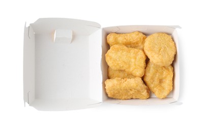 Photo of Delicious nuggets in takeaway package isolated on white, top view. Tasty fast food