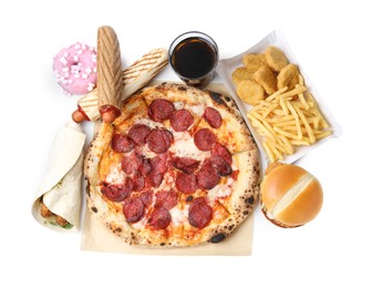 Photo of Delicious pizza, cola and other fast food isolated on white, top view