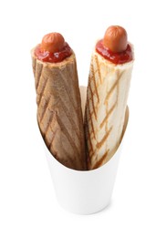 Photo of Delicious French hot dogs in takeaway package isolated on white. Tasty fast food